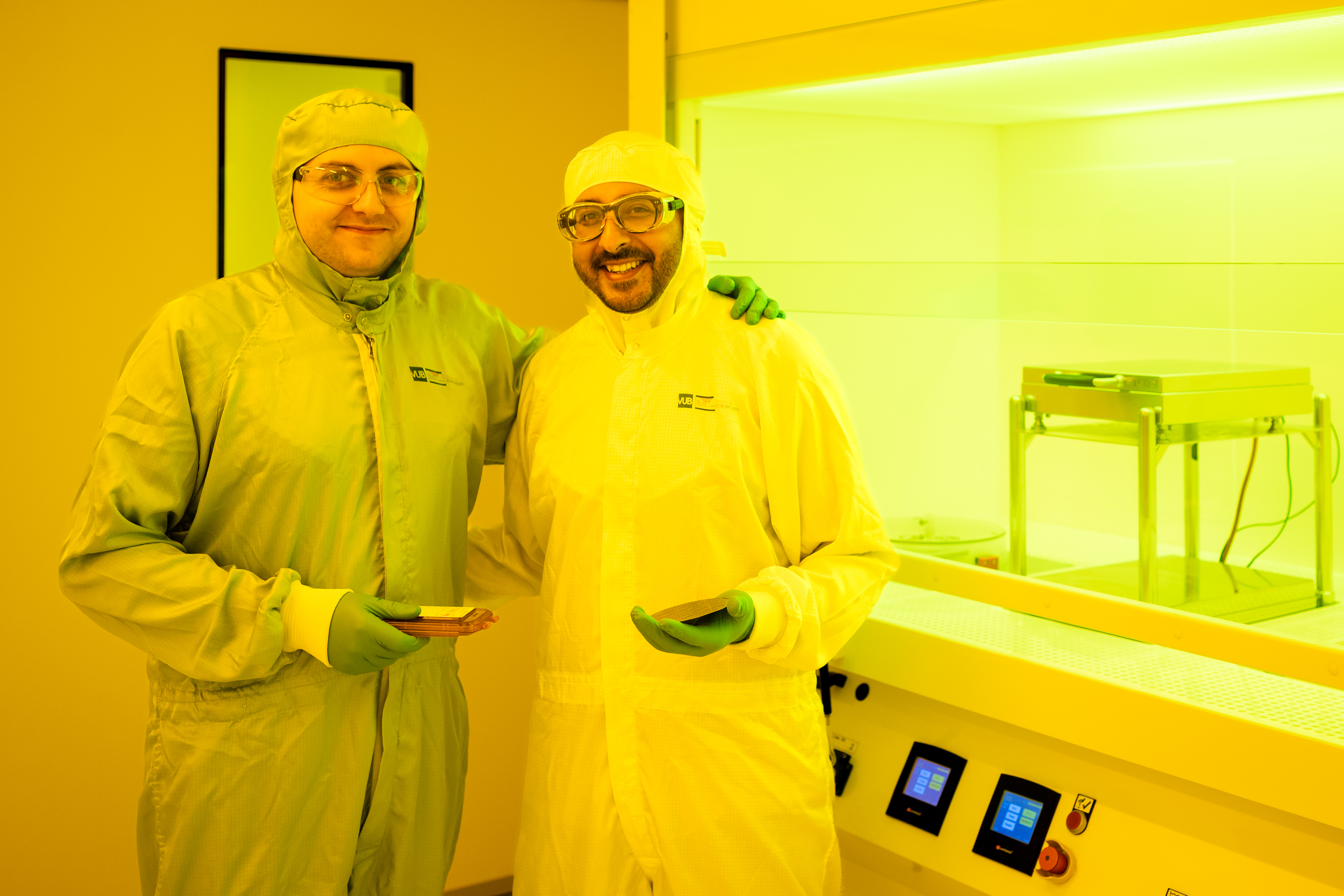 two resaerchers pose smiling in microlab