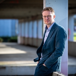 Niels De Temmerman leans against wall